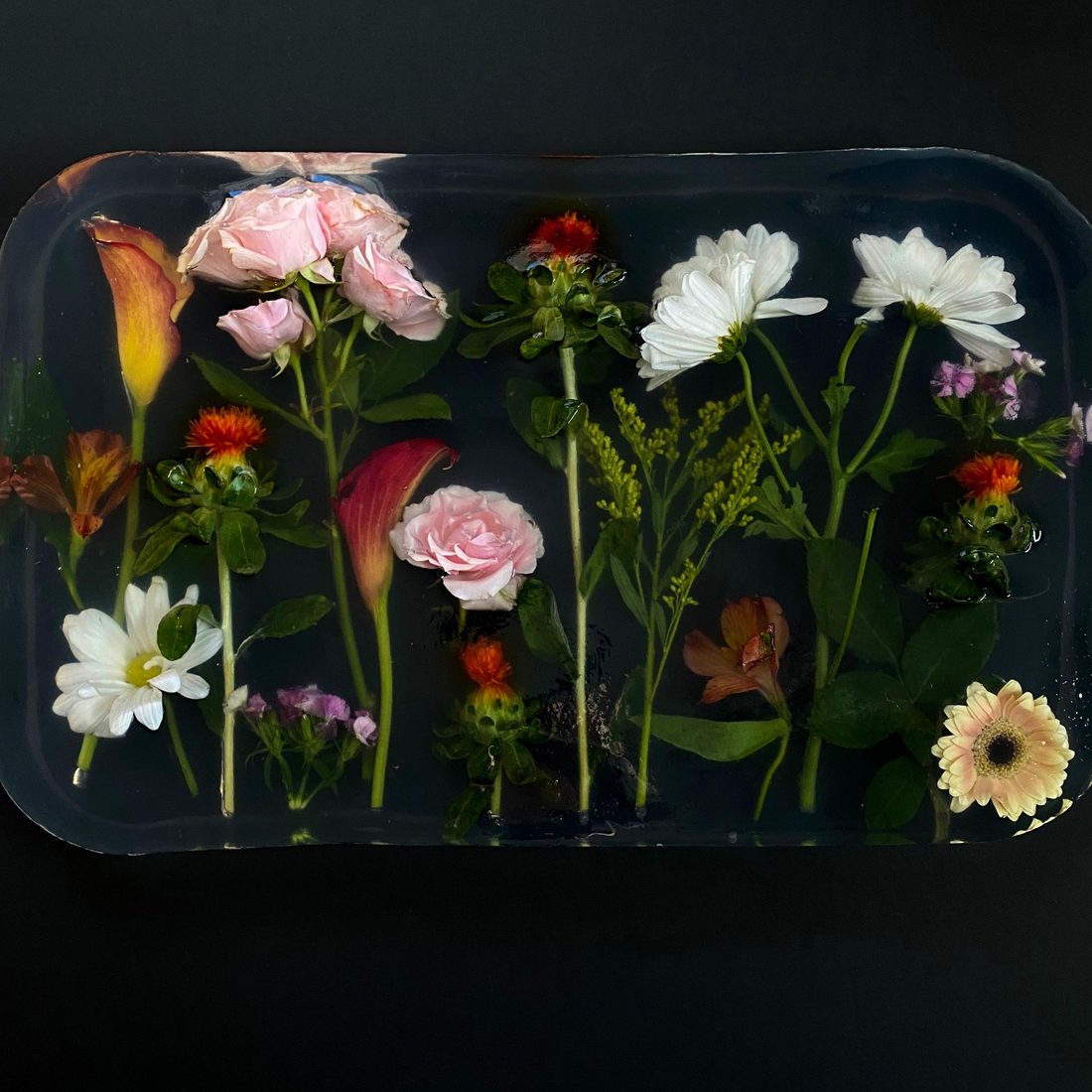 Flowers set in a clear resin block